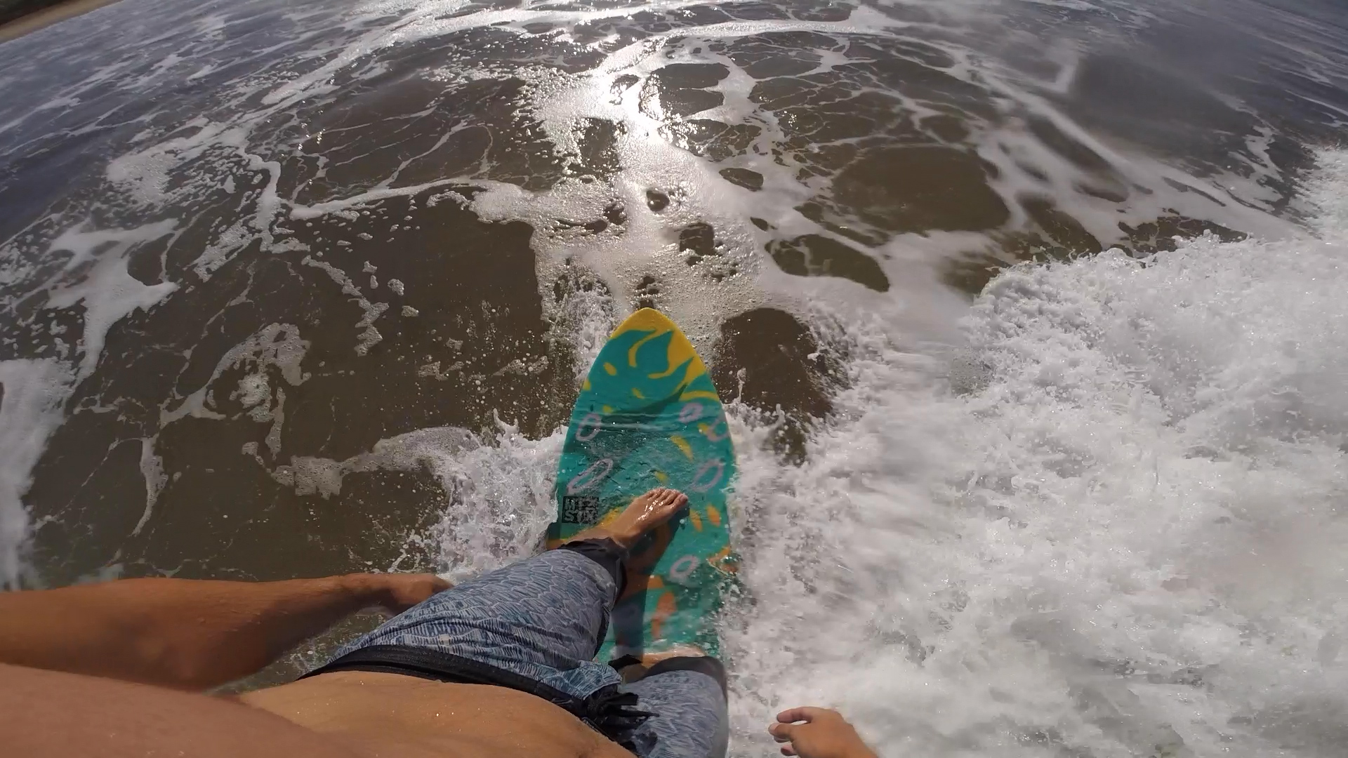 standing on surfboard